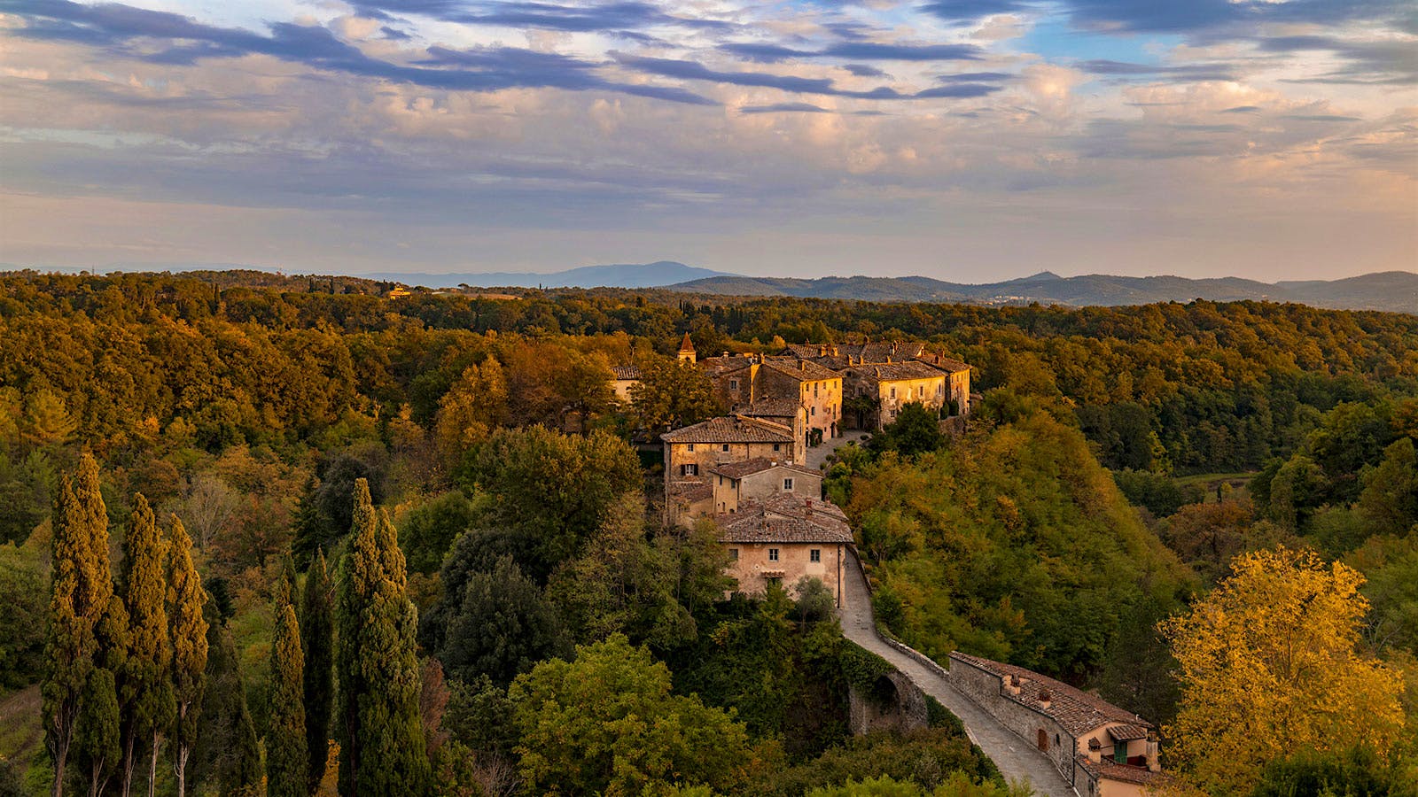  An aerial view of the medieval village that sits, surrounded by woodlands, on the Il Borro estate