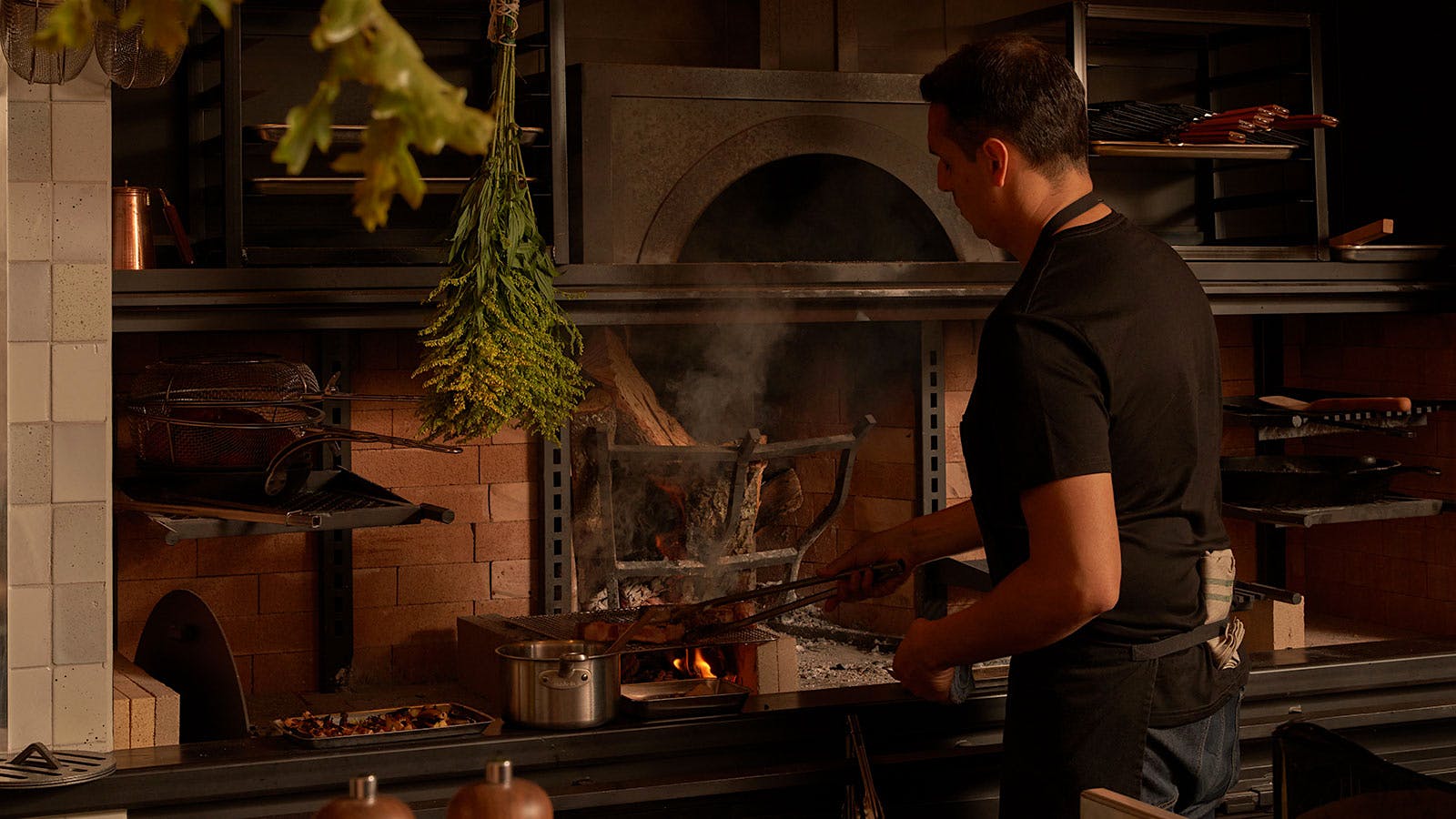  Chef Diego Moya at the hearth inside Little Moutain in Montecito, California