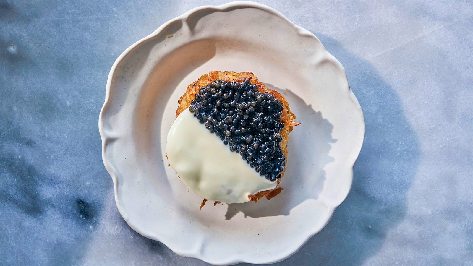 Russ and Daughters’ “Caviar Lover’s Black and White” is one of the appetizing store and cafe’s most popular menu items, and is also available to order online as a gift set that ships nationwide.