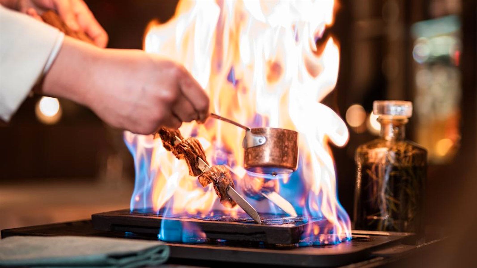  Meat being lit on fire at Affinatore