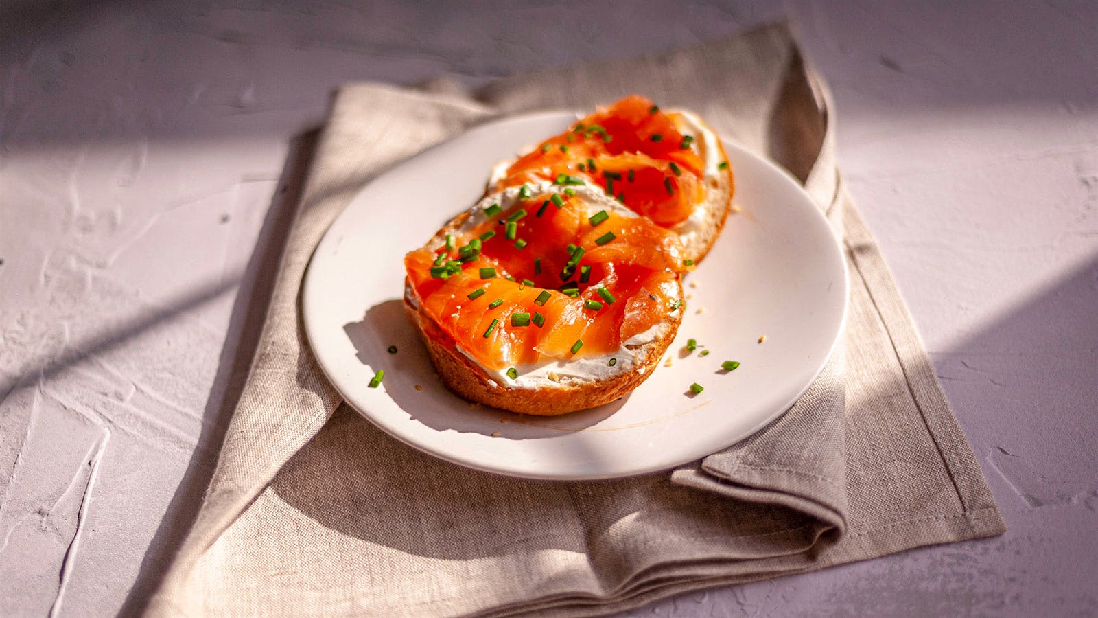  Lox bagel with cream cheese and chives.