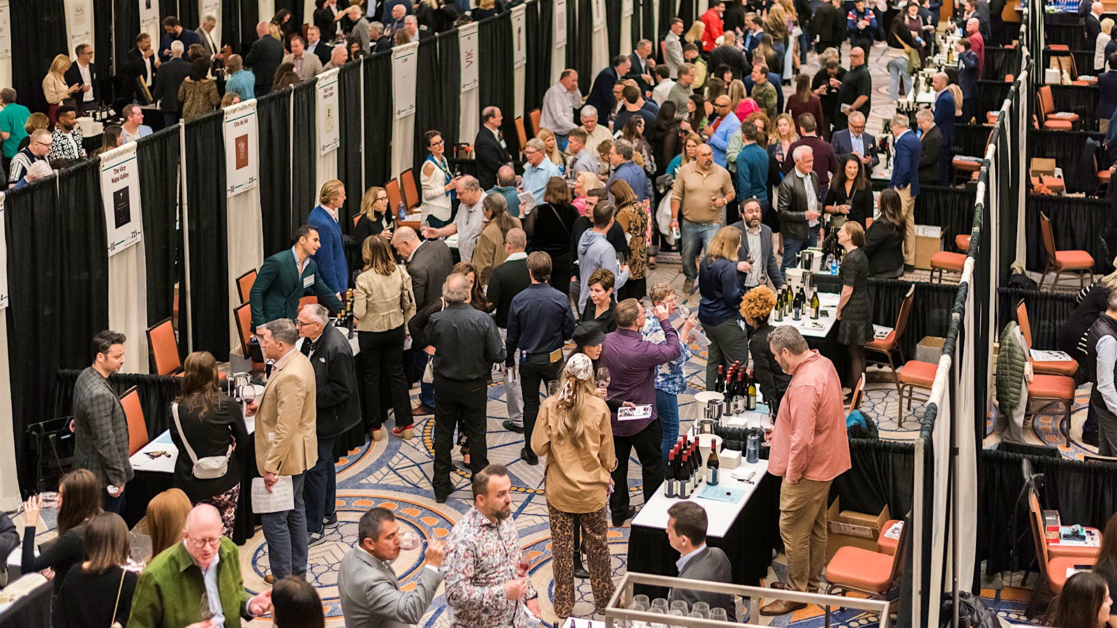  Guests try wines at the 2025 Wine Spectator Grand Tour in Chicago.] 