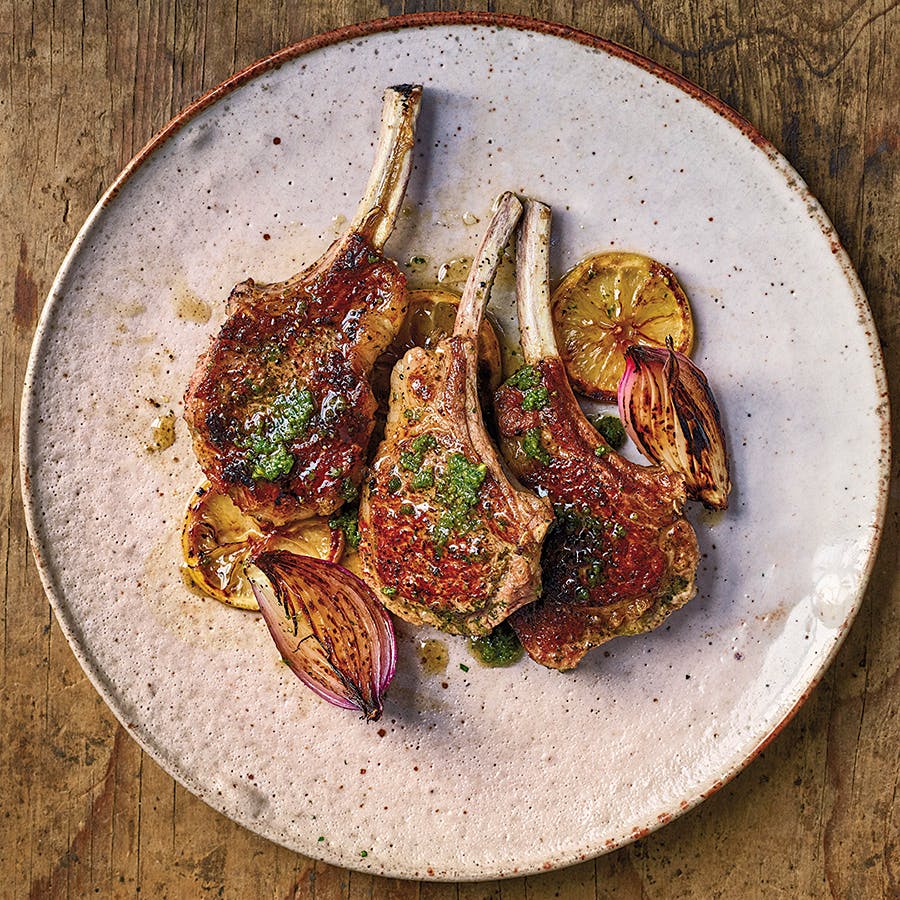 A blend of garlic, fresh green herbs, jalapeños, cumin and other spices coats these lamb chops.