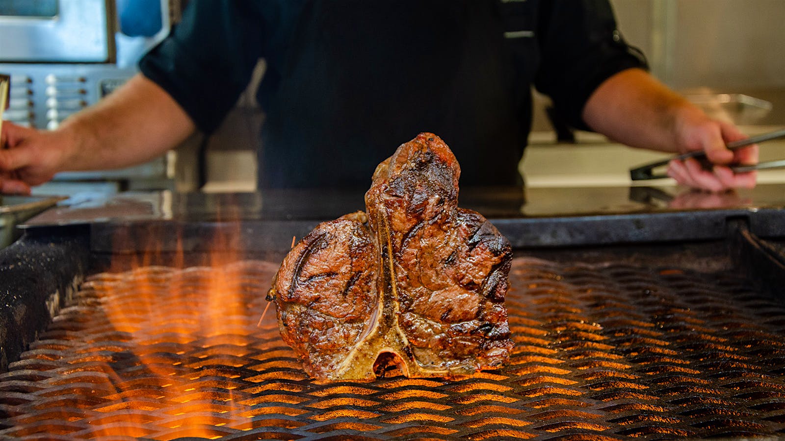  A steak on a grill at Charley&rsquo;s Steak House.