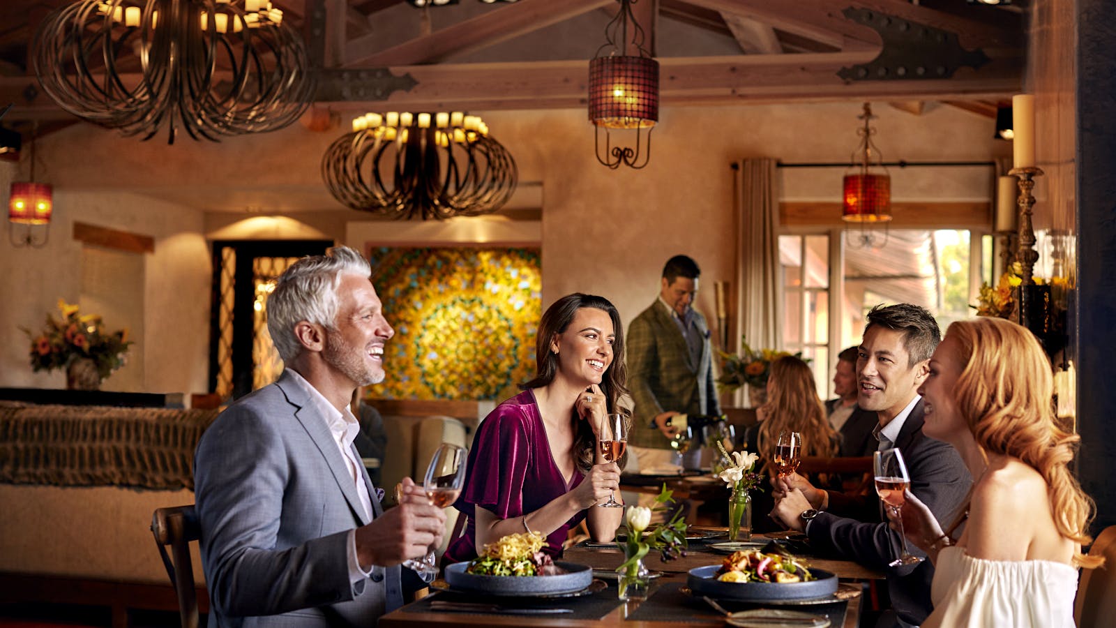 Diners eat and drink wine at the Pony Room at Rancho Valencia in San Diego, California.