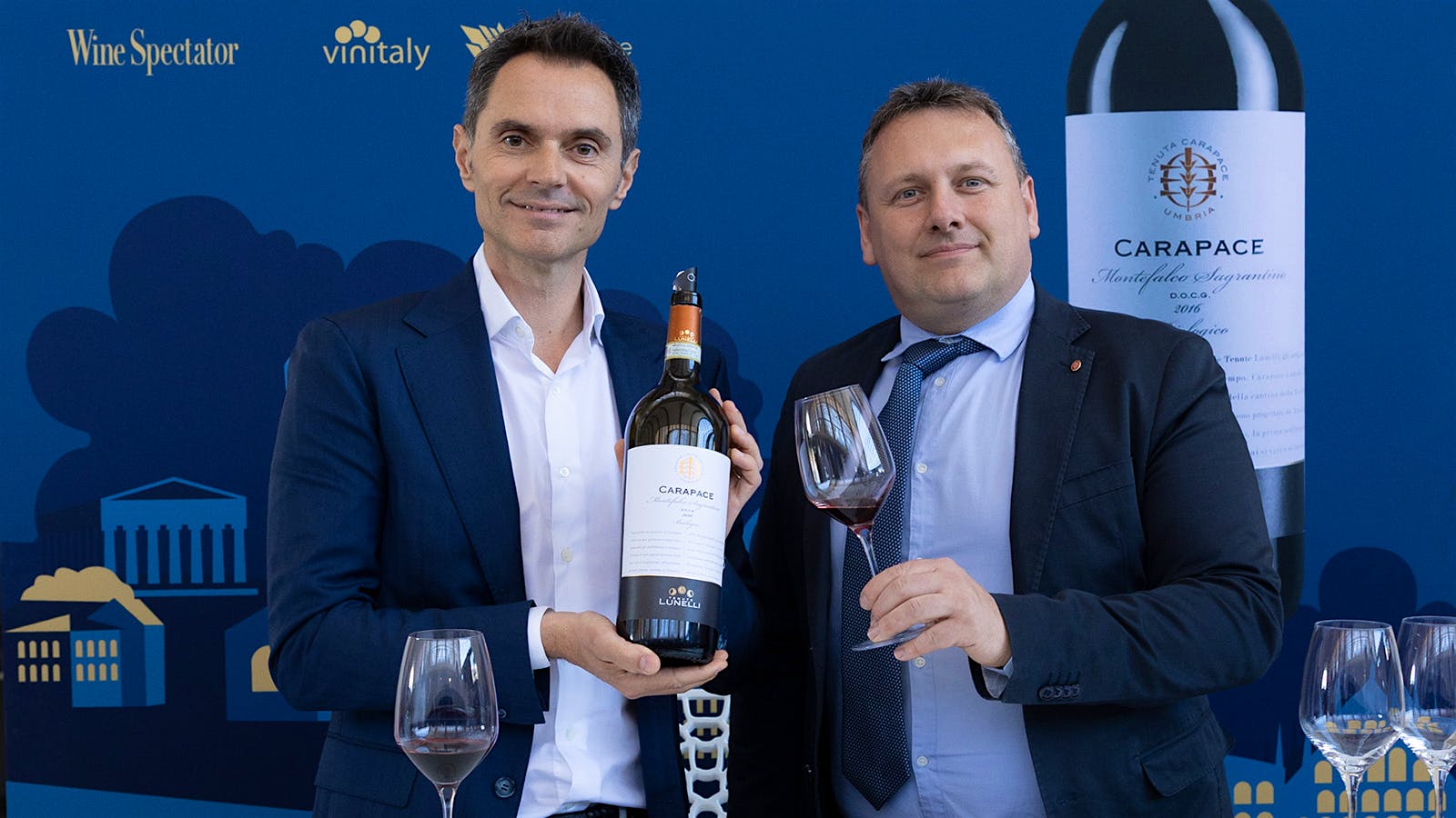  Alessandro Lunelli, left, and Luca Capaldini at OperaWine 2026 in Verona.] 