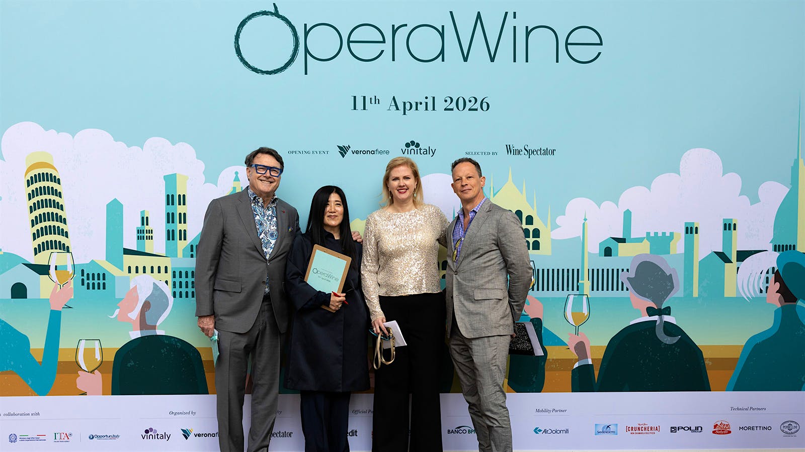  Bruce Sanderson, Vinitaly managing partner Stevie Kim, Alison Napjus and Jeffery Lindenmuth, left to right, at OperaWine 2026 in Verona.] 