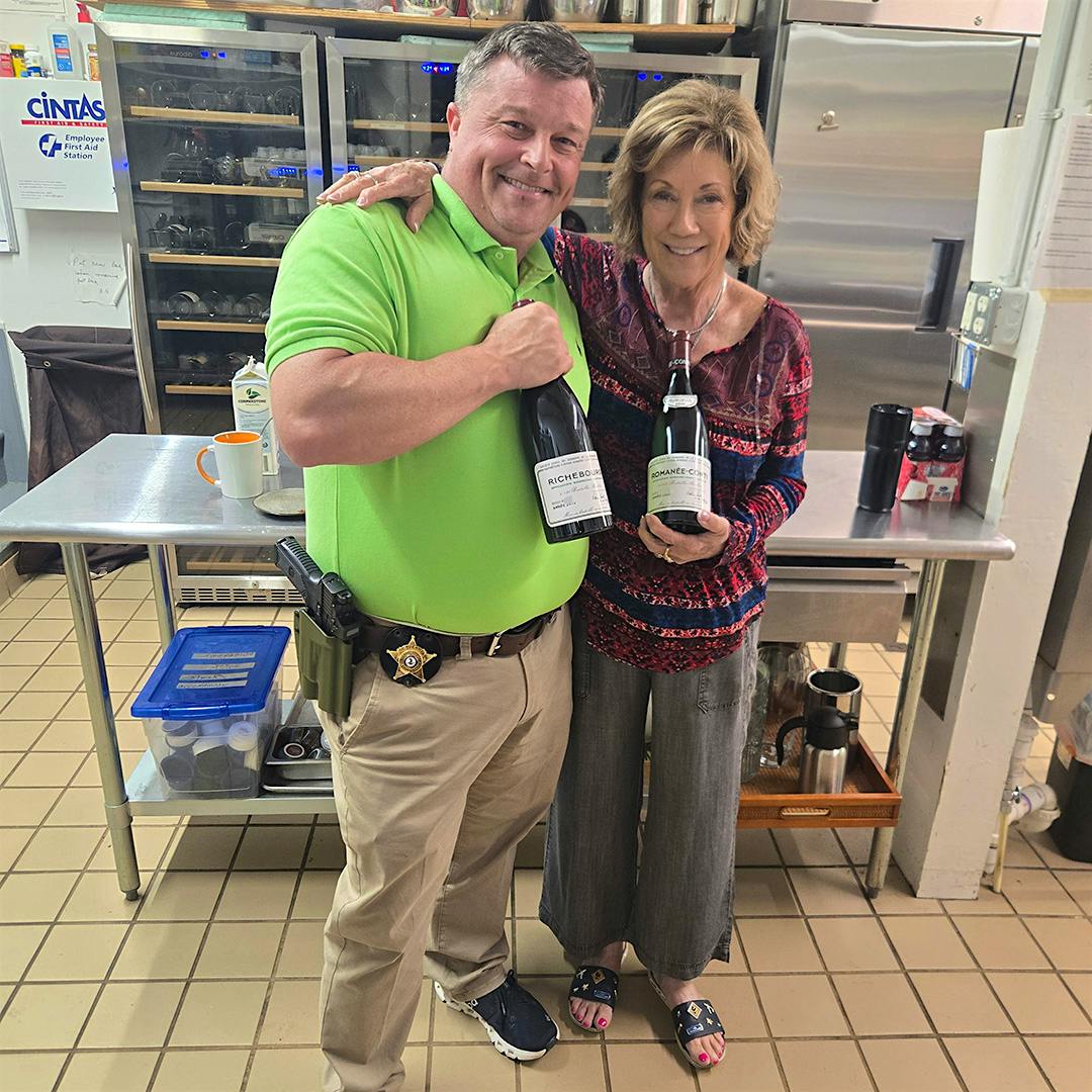 Sgt. Mike Bell of the Clarke County Sheriff’s Office returned two of the bottles of Domaine de la Romanée-Conti to L’Auberge Provençale, owned by Celeste Borel and her husband.