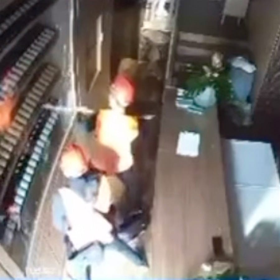 Security camera footage showed two men dressed as construction workers stealing bottles of rare Burgundy.