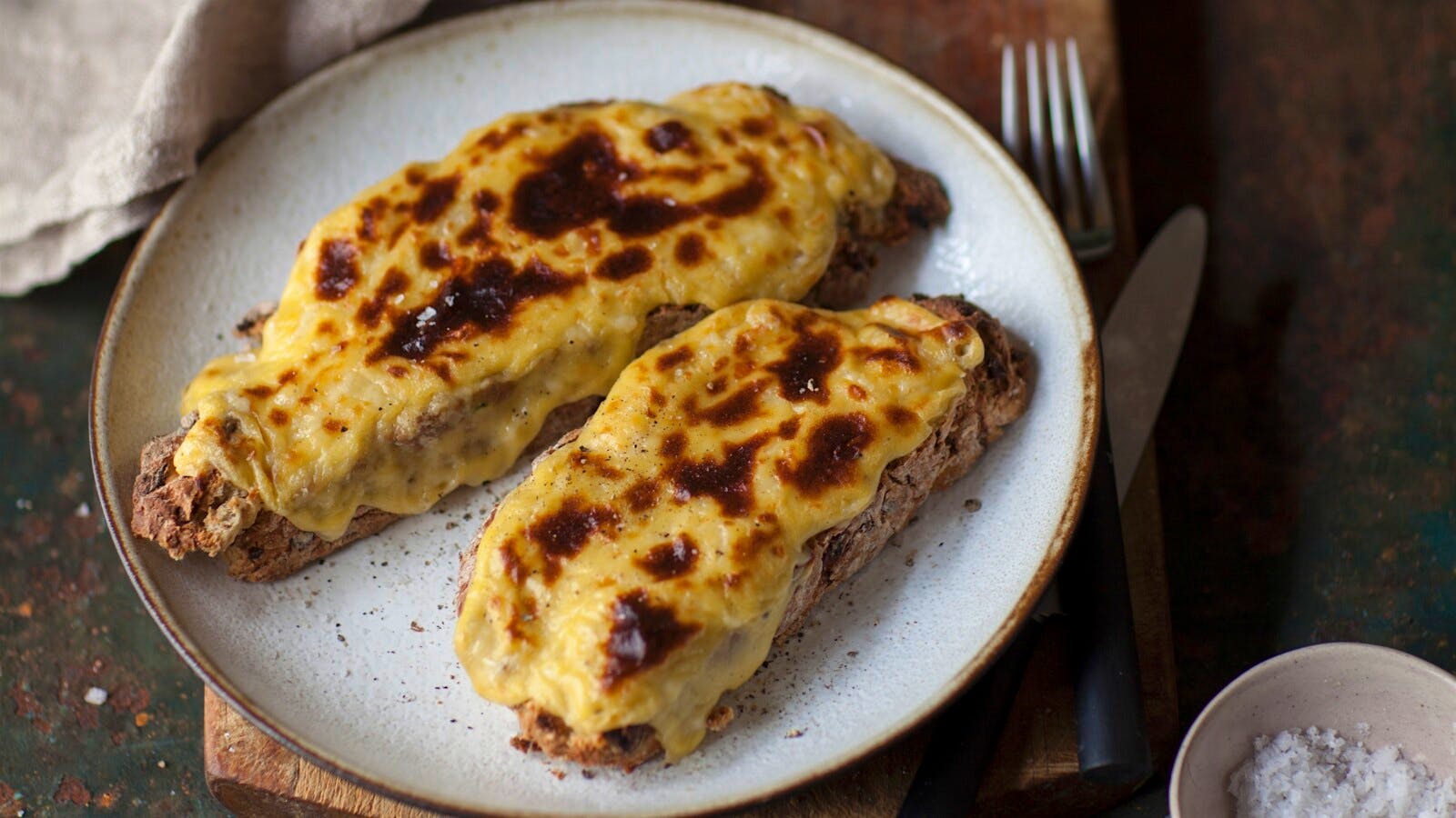Welsh rarebit is to Great Britain as the hamburger is to America.