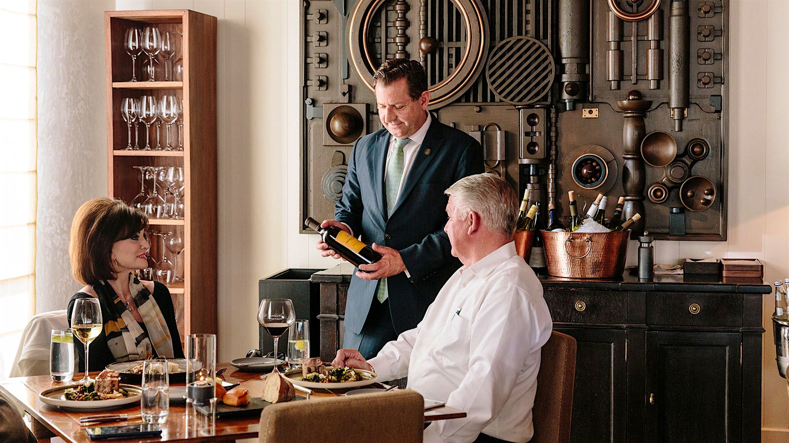 Madera's wine director, Paul Mekis, presents a wine