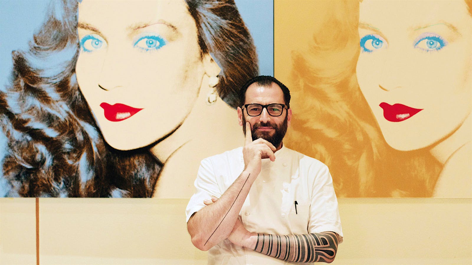 Portrait of chef Iacopo Falai in front of an artwork