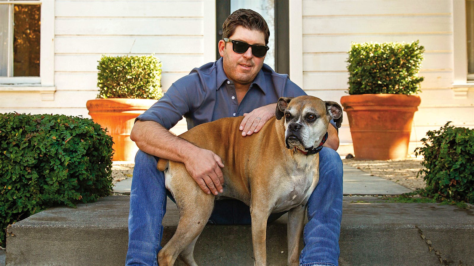 Portrait of vintner Dave Phinney and his Boxer, Coco