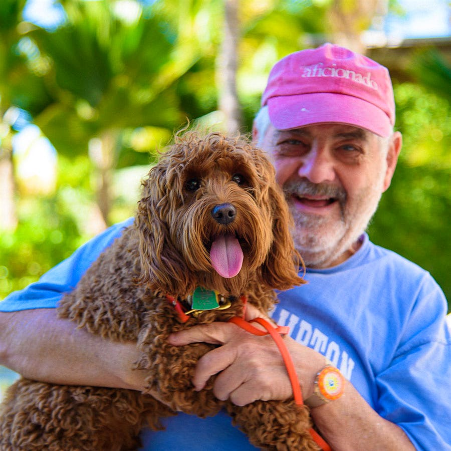 Wine Spectator editor and publisher Marvin R. Shanken relaxes with Lionel, a Miniature Goldendoodle