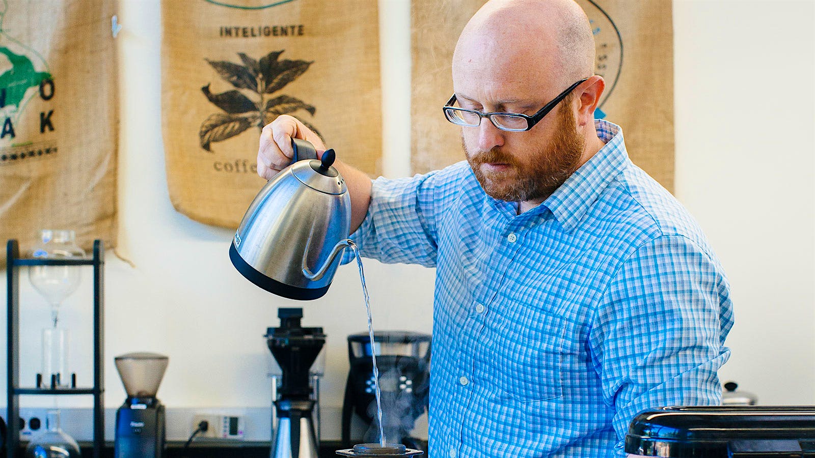 William Ristenpart pouring hot water into an an AeroPress