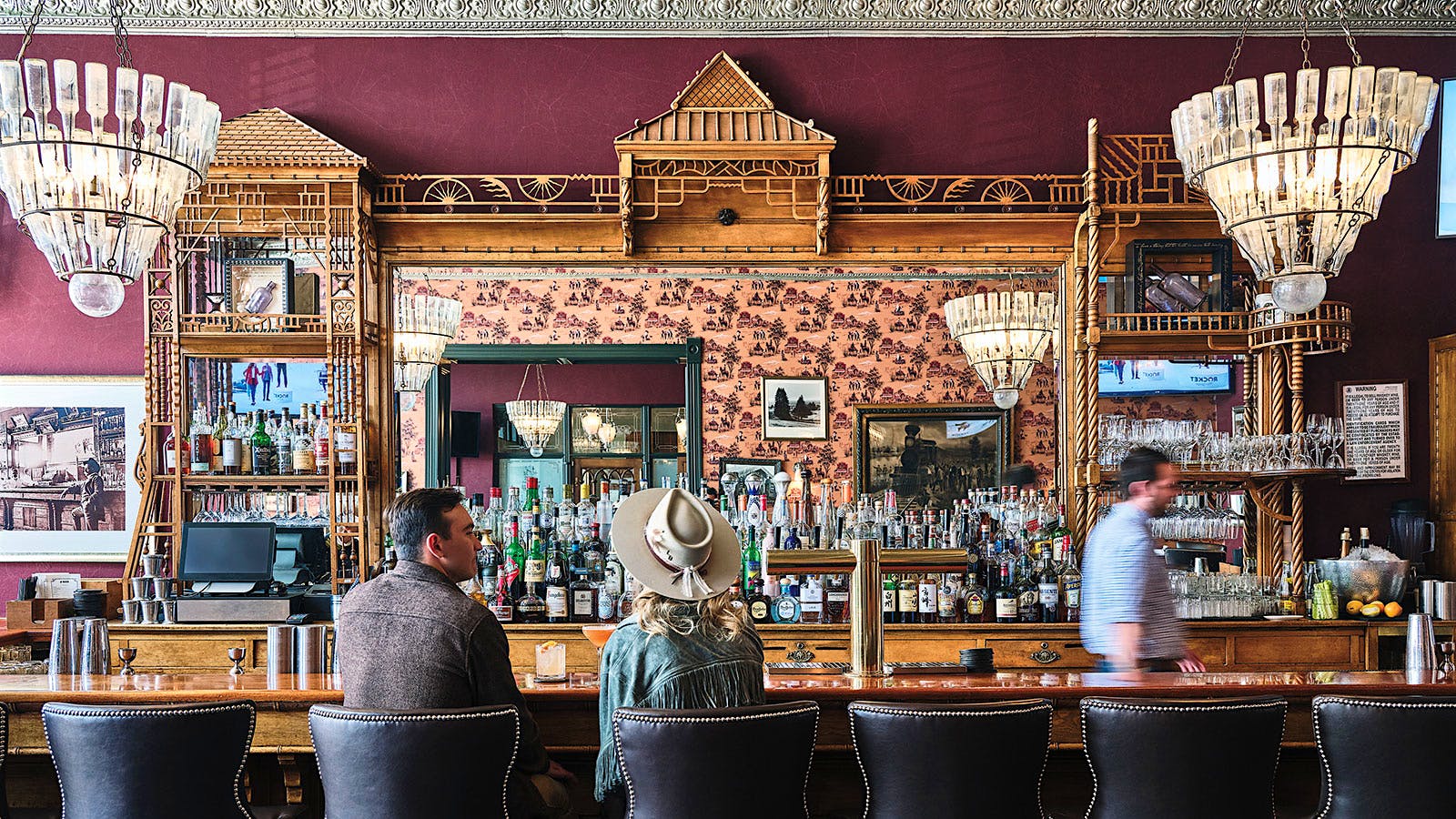 A couple seated at J-Bar at the Hotel Jerome in Aspen, Colorado