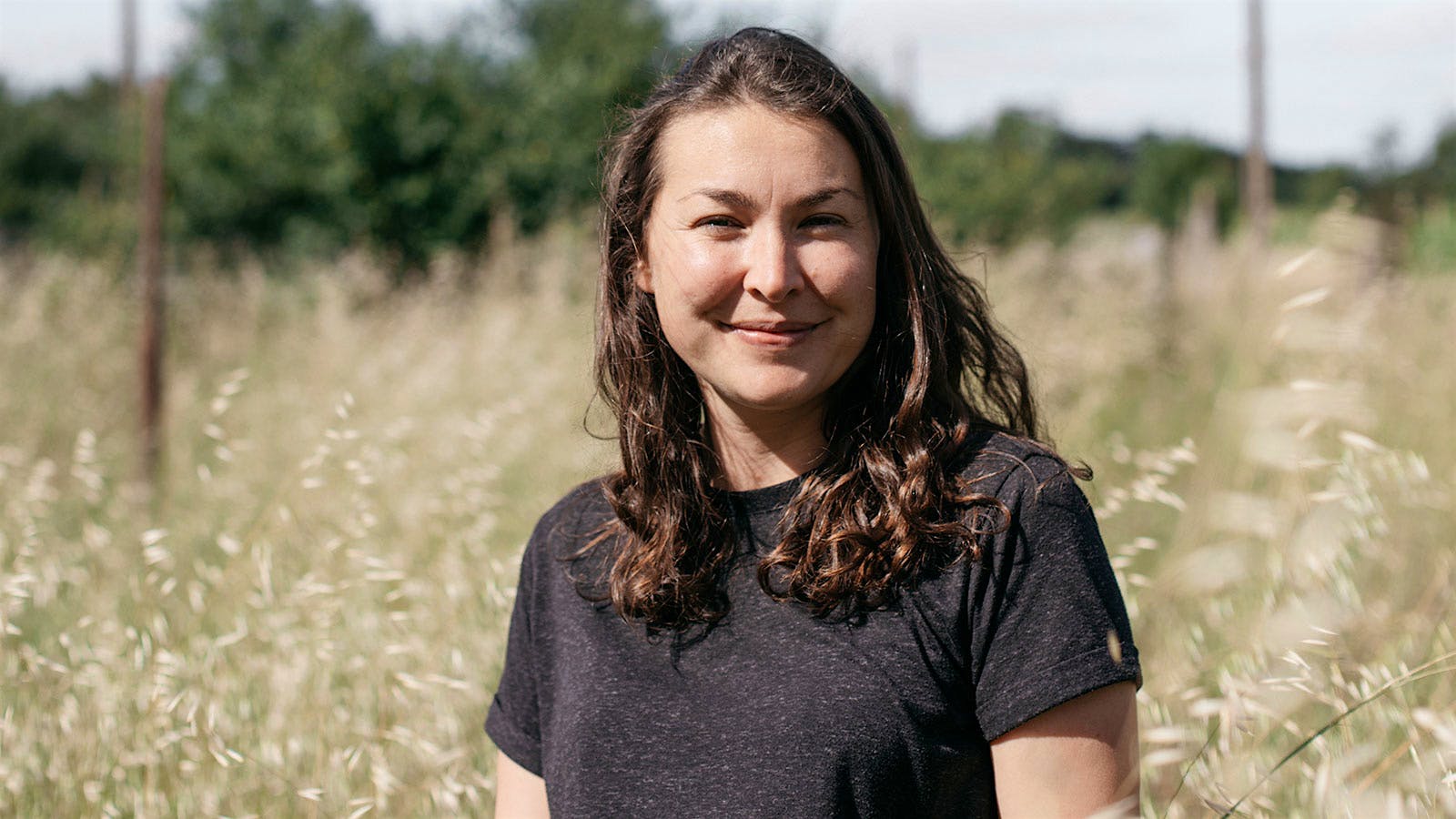 Vanessa Cherruau of Château de Plaisance in a field of grasses