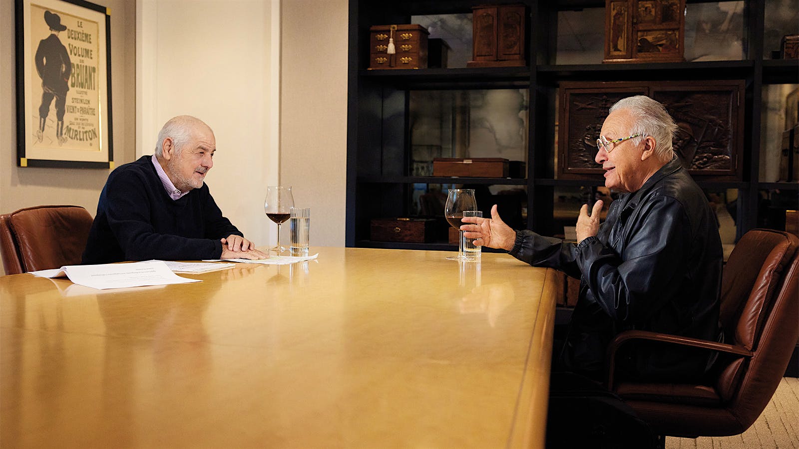 Marvin R. Shanken and Angelo Gaja sit in discussion at a conference table.