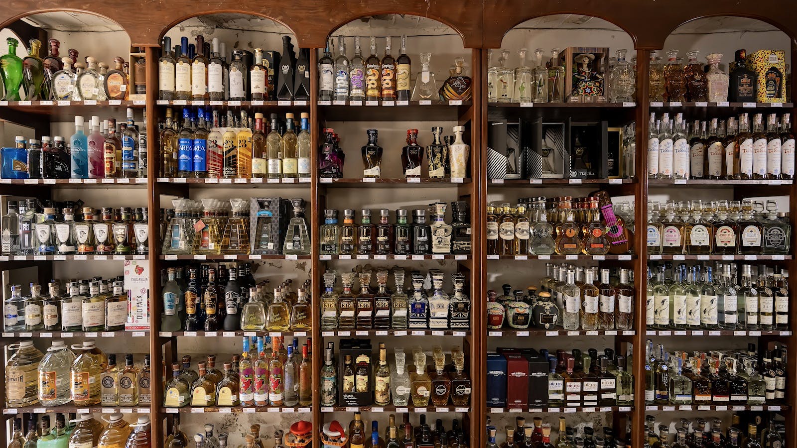 A display of bottles for sale at El Buho liquor store, owned by Emilio Ferreira Ruiz, in Tlaquepaque, Jalisco, Mexico.