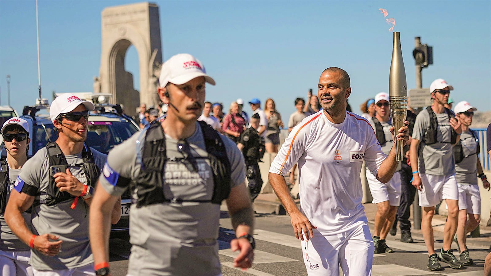 Tony Parker runs with the 2024 Olympic torch in Paris, France.