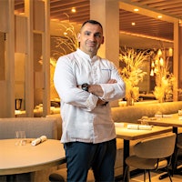 The 68-seat dining room, created by Parisian designer Caroline Egasse, features wood panels, beige tones and gray banquettes, which makes for a soothing atmosphere for the food to shine.