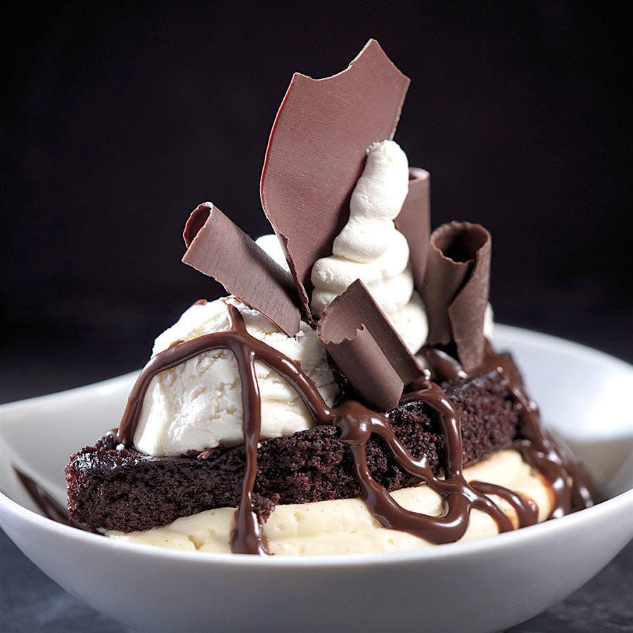 At HMF at the Breakers, chef Benjamin Metais tops his warm chocolate “Whoopie Pie” sundae with chocolate curls.