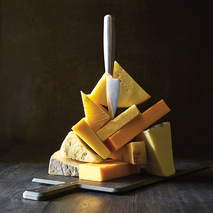 Clockwise from top: Buonatavola Provolone; Prairie Breeze; Tillamook Extra Sharp; Fulvi Pecorino Romano; Quicke’s Mature Cheddar; Cabot Seriously Sharp; Fiore Sardo; Point Reyes Original Blue; Cellars at Jasper Hill Cabot Clothbound; Asiago d’Allevo