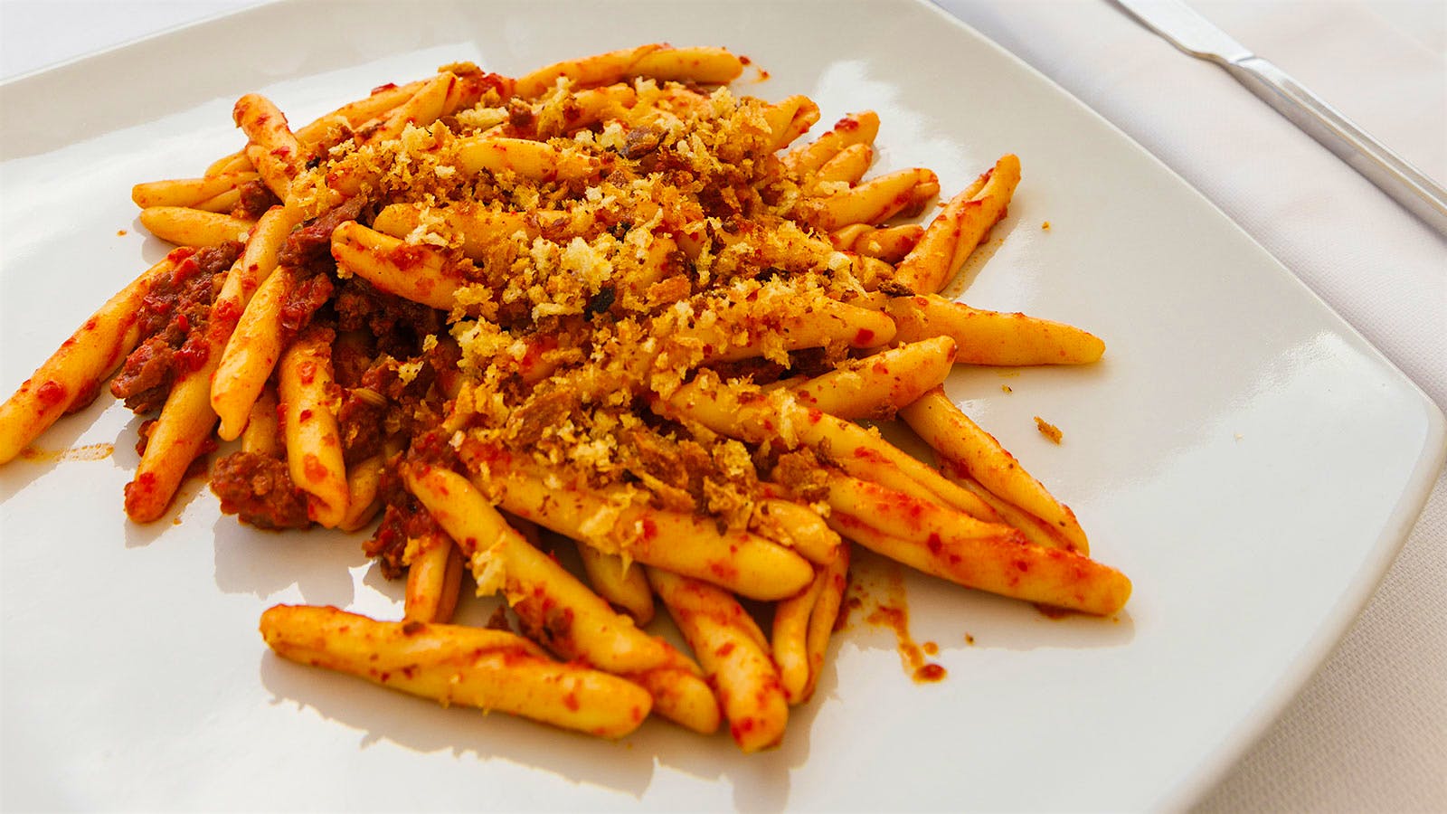 A plate of Atrascinati con Mollica e Peperoni Cruschi