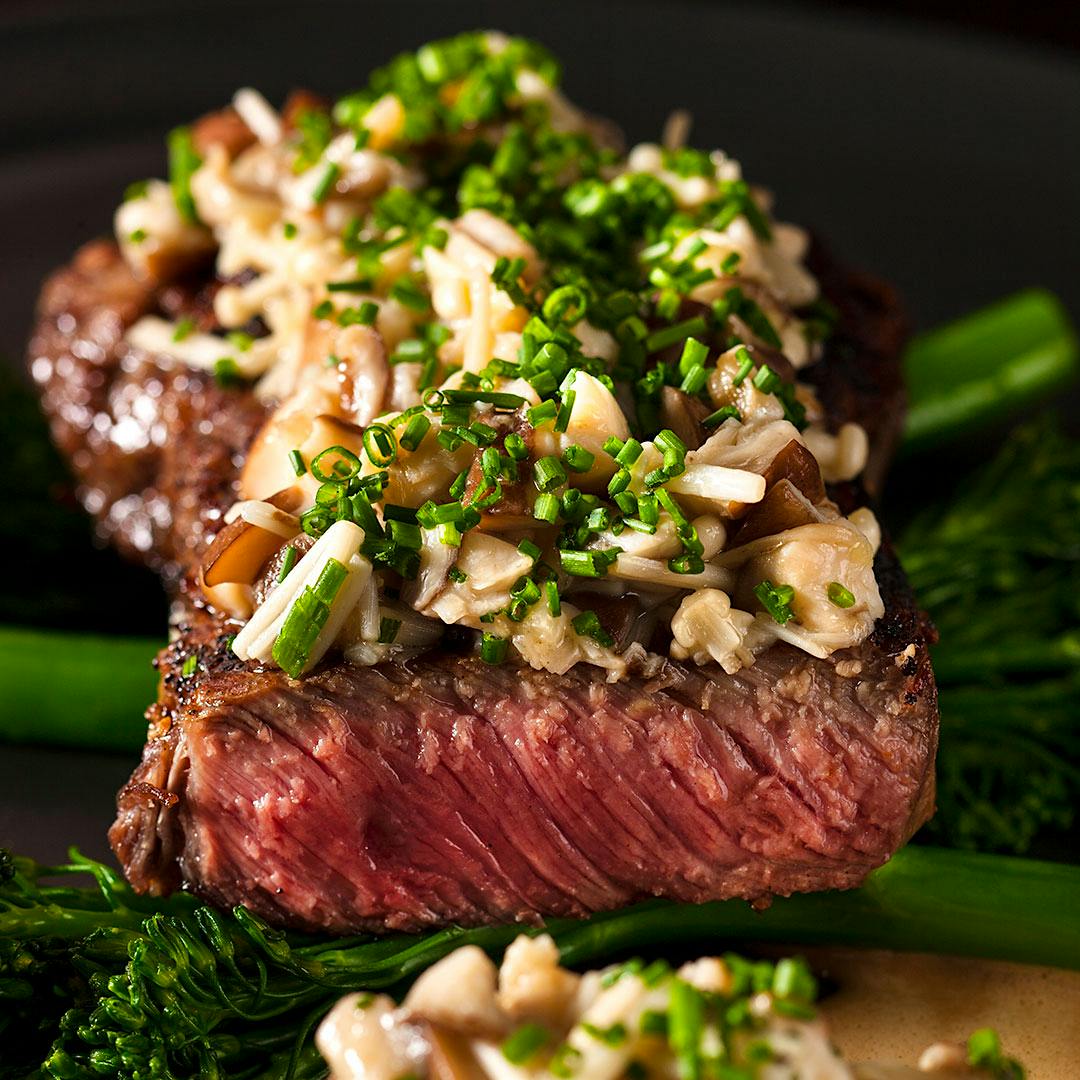 Sirloin steak with ginger mushrooms, broccoli rabe and soy-caramel sauce