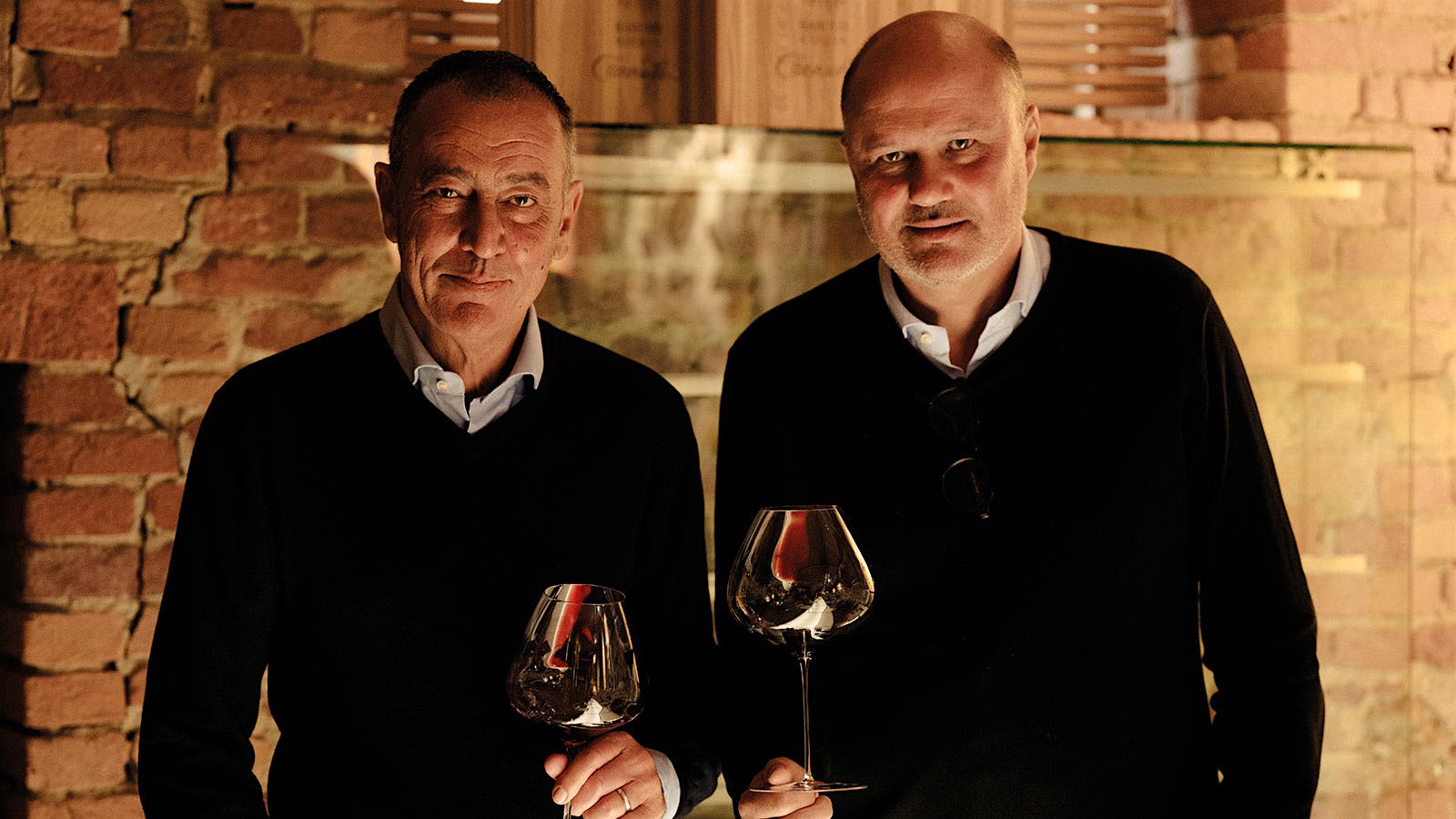 Stefano Chiarlo and Alberto Chiarlo in the cellar at Michele Chiarlo winery in Piedmont, Italy
