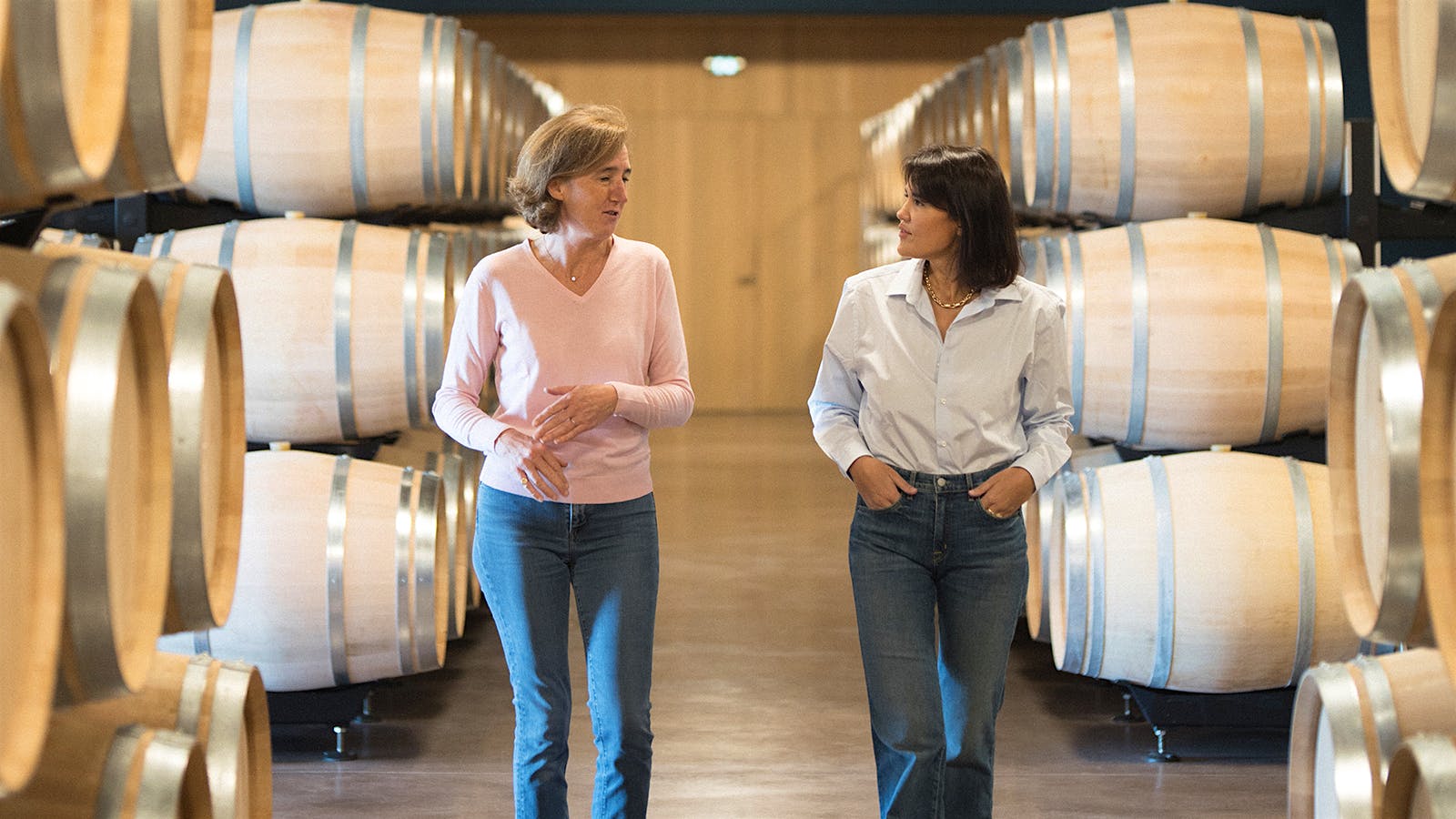 Nathalie Perrodo and Marjolaine Maurice de Coninck in the barrel room at Ch&acirc;teau Lab&eacute;gorce in Bordeaux, France