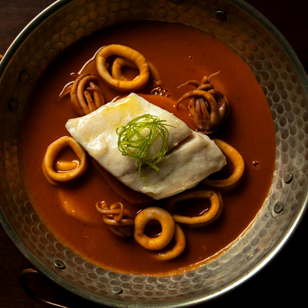 Cataplana is a traditional aromatic seafood stew from Portugal’s Algarve region; Emeril and E.J.’s version puts halibut and squid center stage.