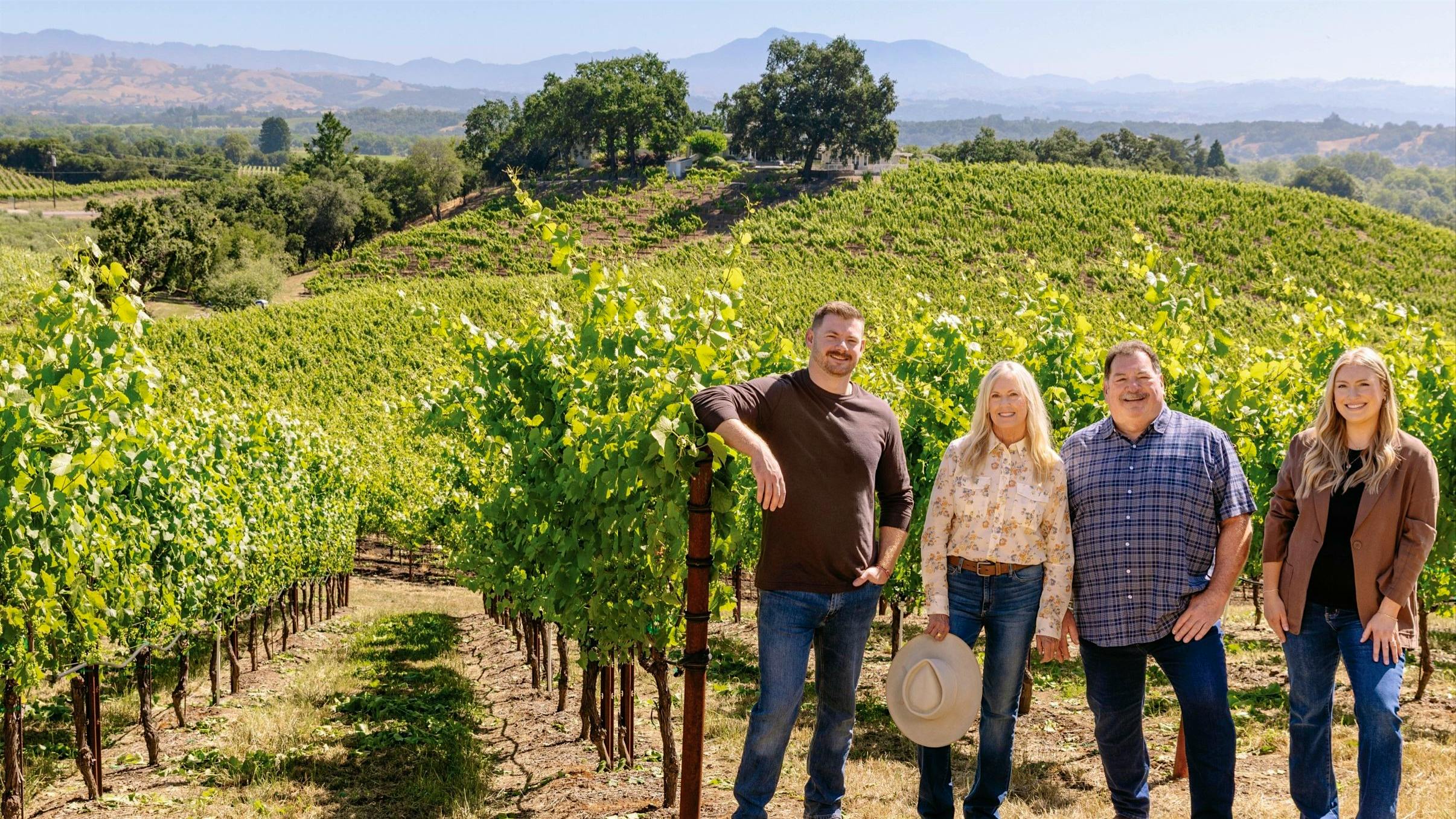 Ryan Rochioli, his parents, Theresa and Tom, and sister Rachael (from left) stand in the Big Hill parcels of their family estate in Sonoma’s Russian River Valley.