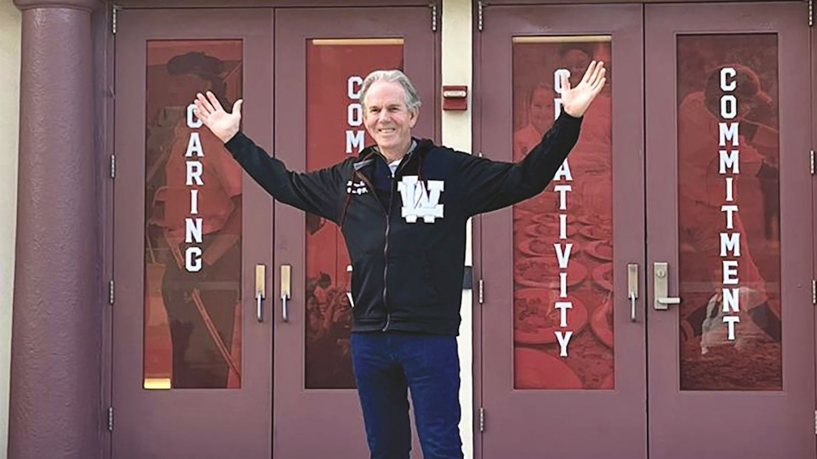 Thomas Keller stands in front of his old high school, Lake Worth Community High School, in Palm Beach, Fla..