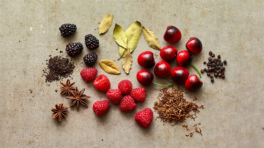 Cherries, berries, star anise and other objects representing the flavors and aromas of Grenache